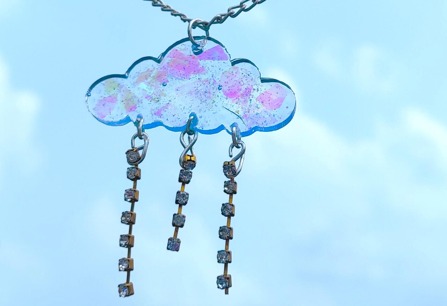 resin pendent in front of clouds